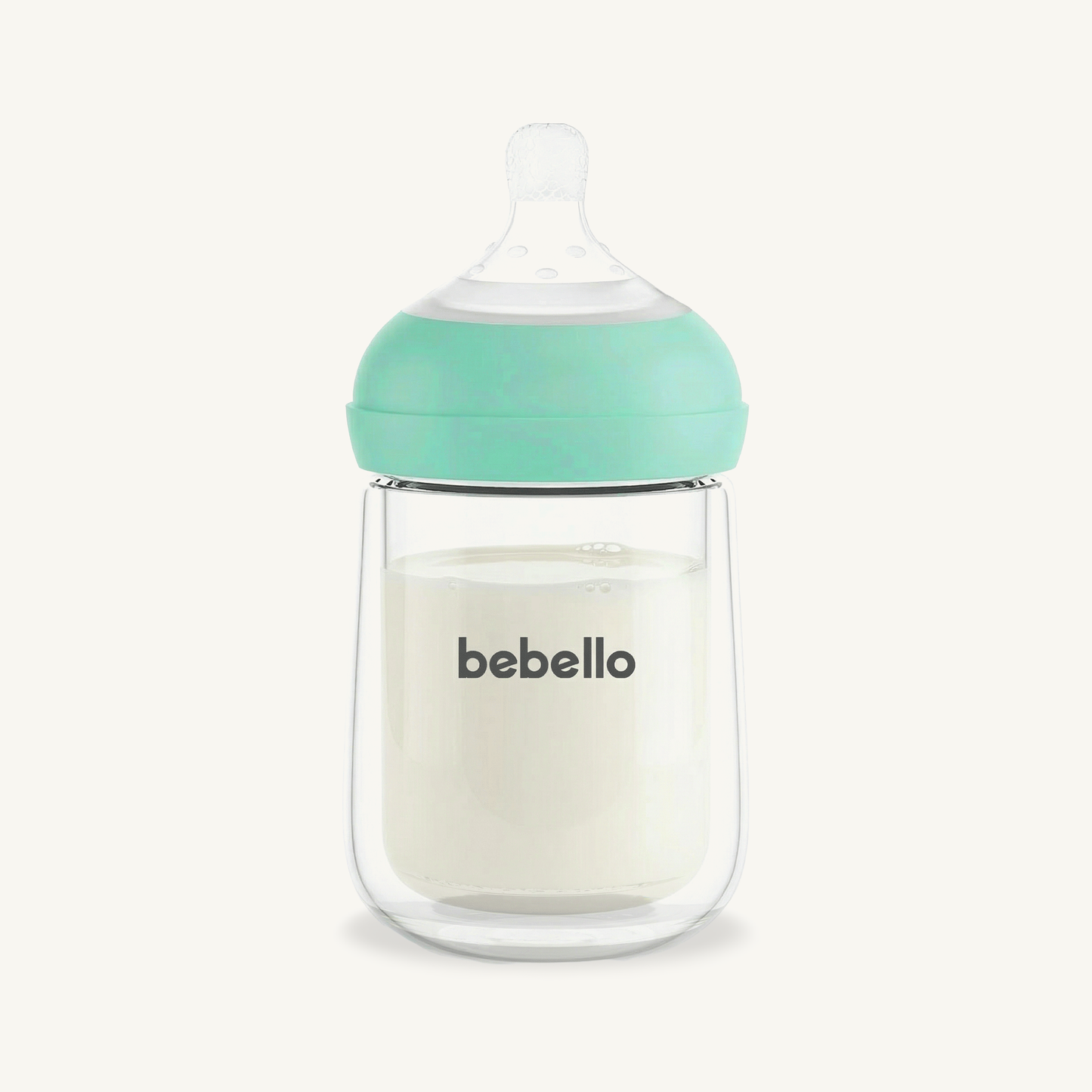 Bebello baby bottle with a green cap on a white background